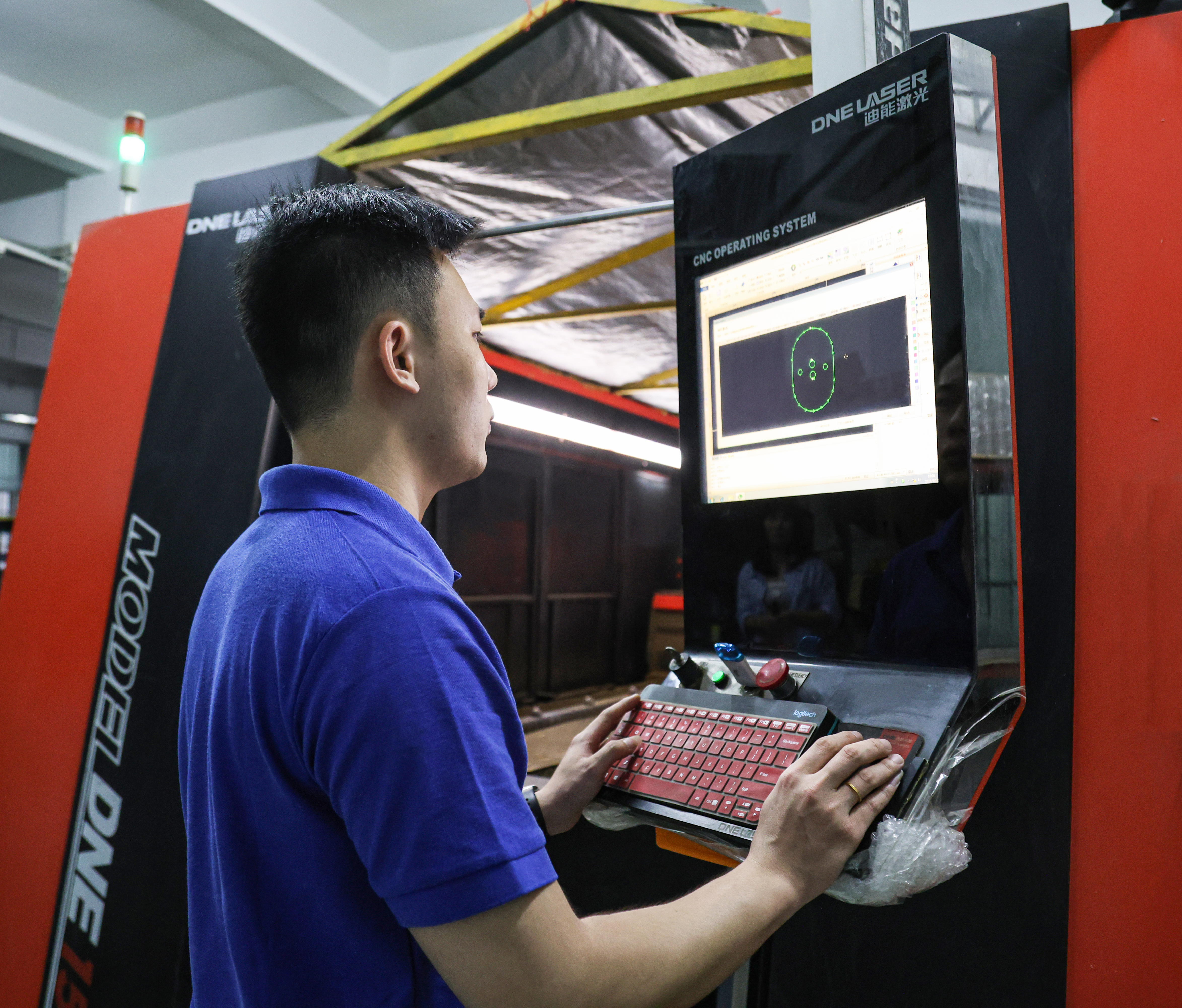 Technician operating production equipment